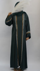 Elegant dark green abaya with gold and silver embroidery, paired with a feathered hijab accessory.