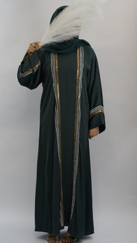 Elegant dark green abaya with gold and silver embroidery, paired with a feathered hijab accessory.