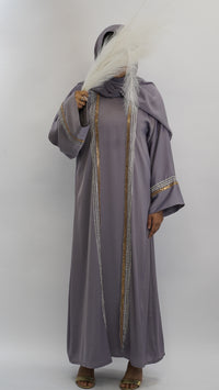 Elegant grey abaya with gold and silver beaded trim, paired with matching hijab and feather accessory.