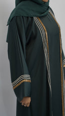 Elegant dark green abaya with gold and silver embellishments, featuring detailed sleeve and side stripes.
